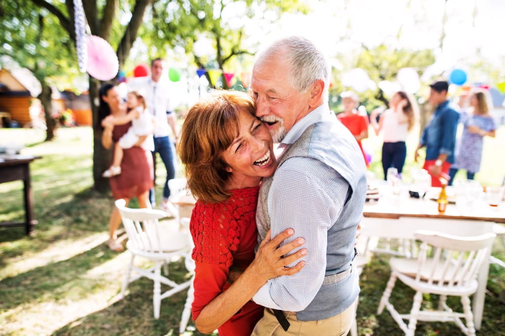 A resident couple having fun at a party near The Claiborne at Newnan Lakes in Newnan, Georgia. 