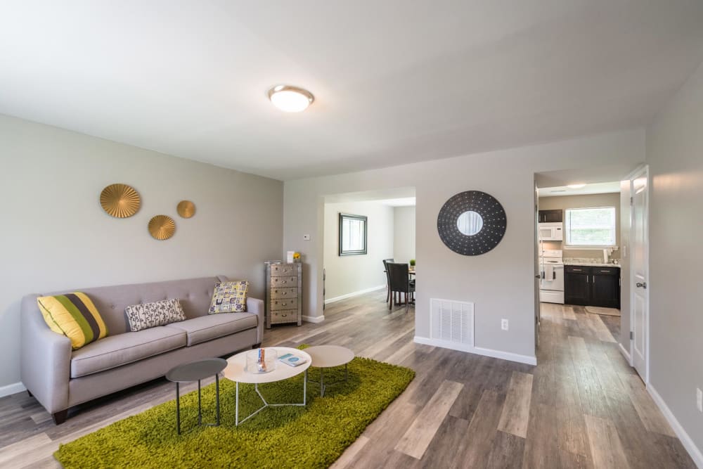 An apartment living room, dining room and kitchen at The Springs in Parkville, Maryland