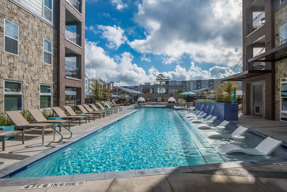 Sparkling resort-worthy swimming pool at Enclave at Woodland Lakes in Conroe, Texas