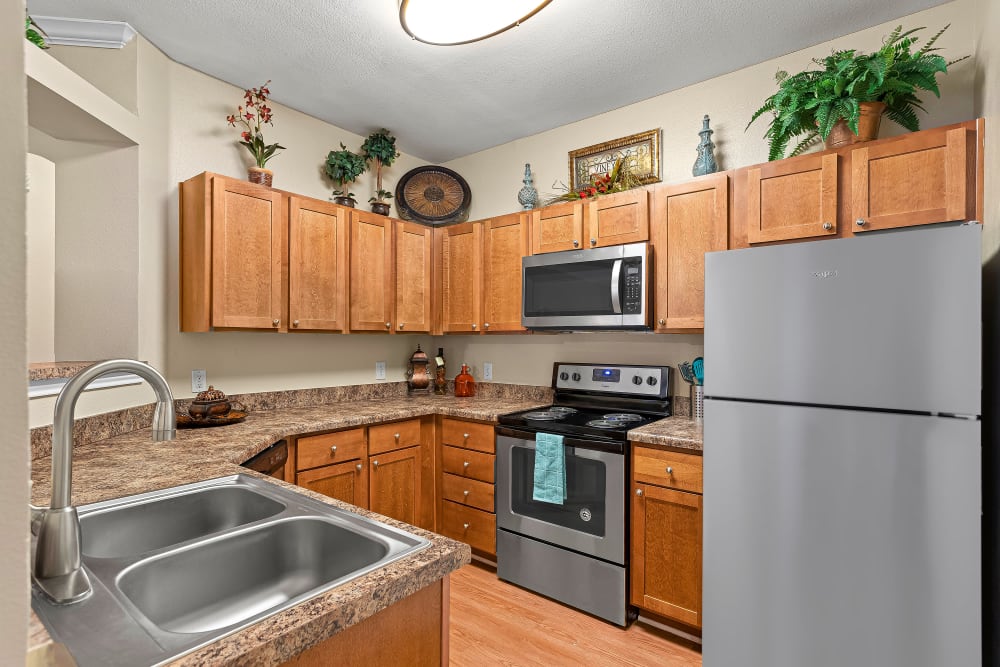 Kitchen with stainless steel appliances at Villas at Medical Center