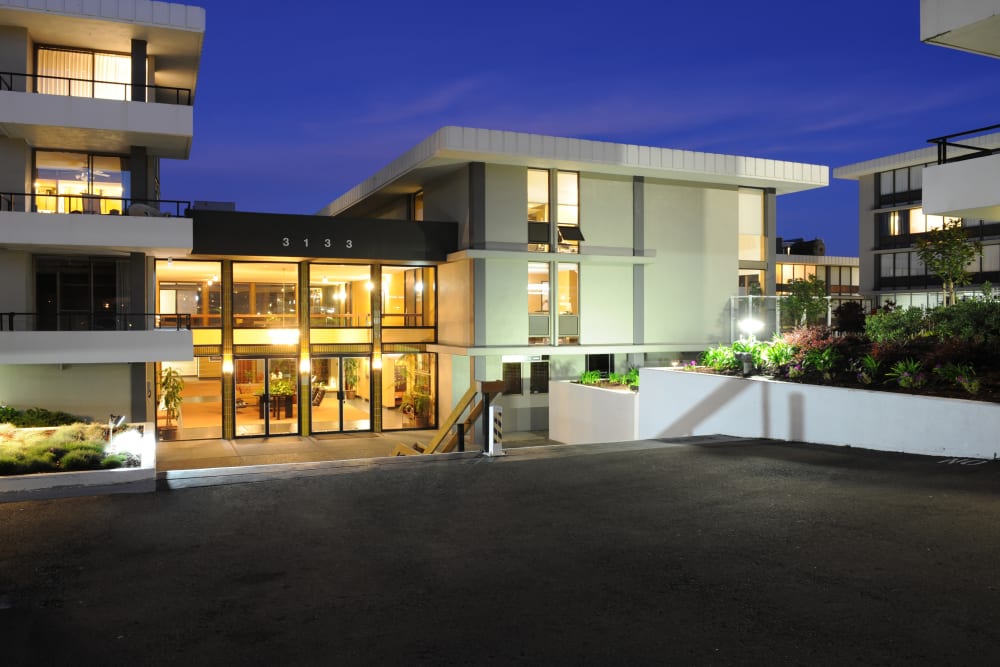 Skyline Terrace Apartments well-lit entrance at night in Burlingame, California