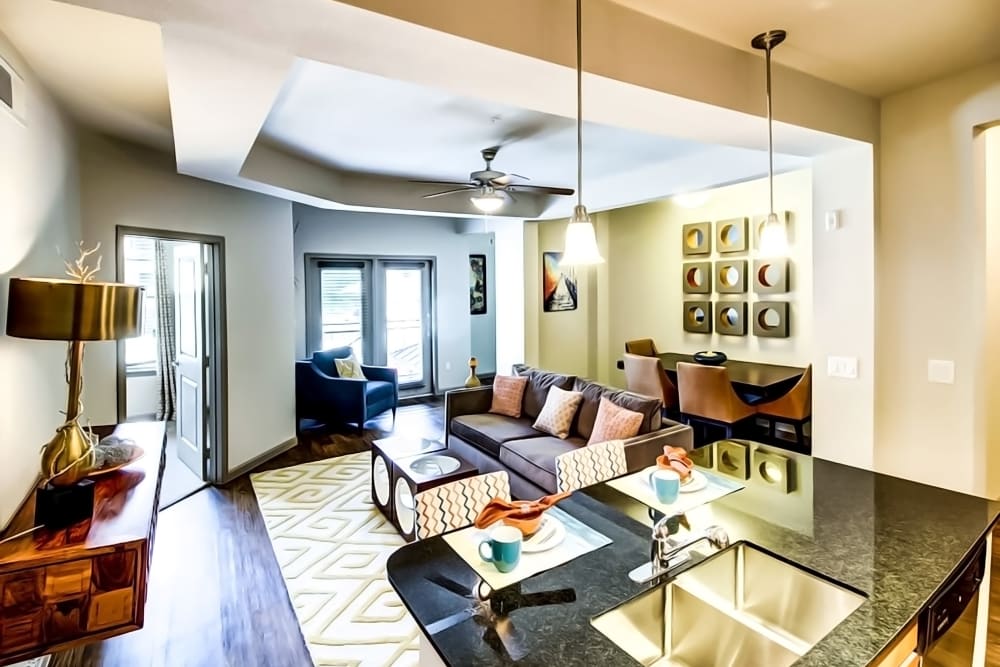 Bright living room with patio access at Enclave at Grapevine in Grapevine, Texas