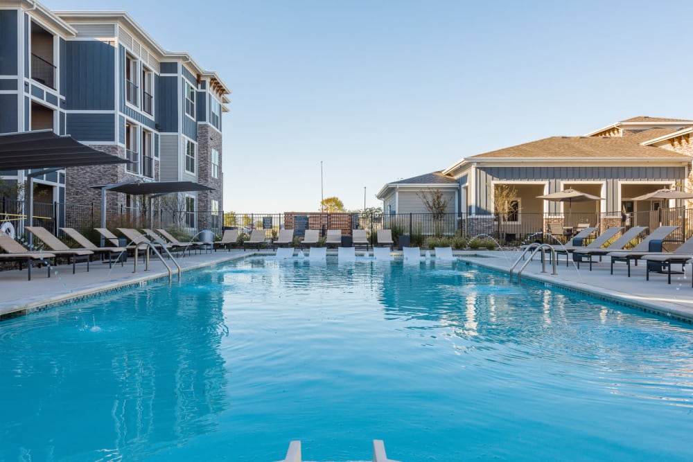 Resort-style swimming pool at Enclave at Westport in Roanoke, Texas