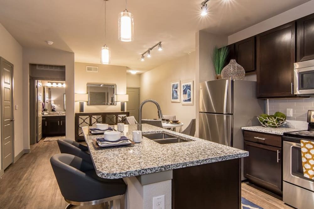 Fully equipped kitchen at Enclave at Westport in Roanoke, Texas