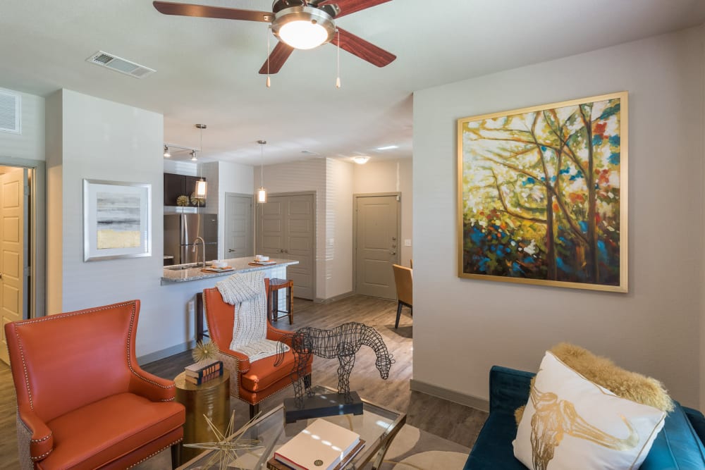 Living room with ceiling fan at Enclave at Westport in Roanoke, Texas