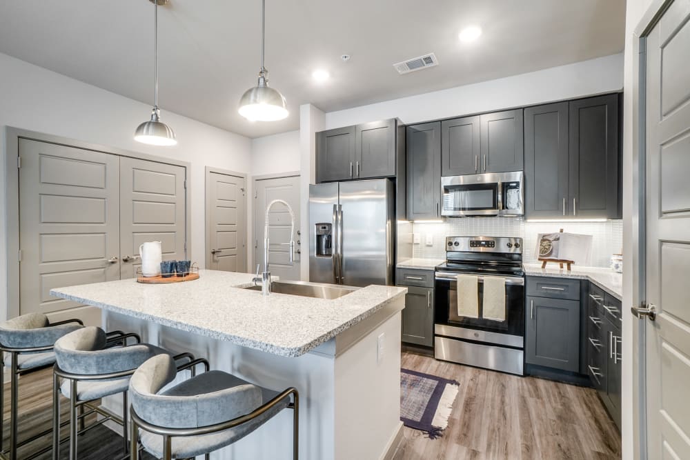 Fully equipped kitchen at One90 Firewheel in Garland, Texas