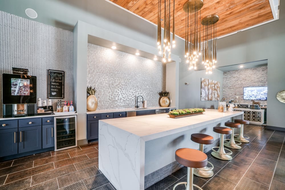 Community kitchen and coffee bar at One90 Firewheel in Garland, Texas