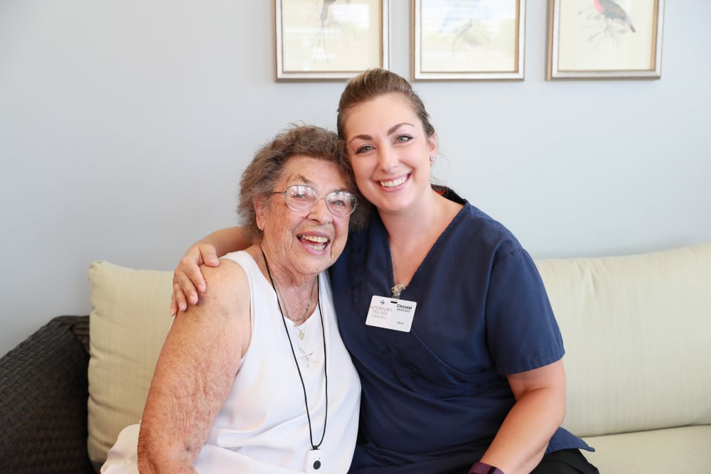 Resident and caretaker hugging at Serenity in East Peoria, Illinois