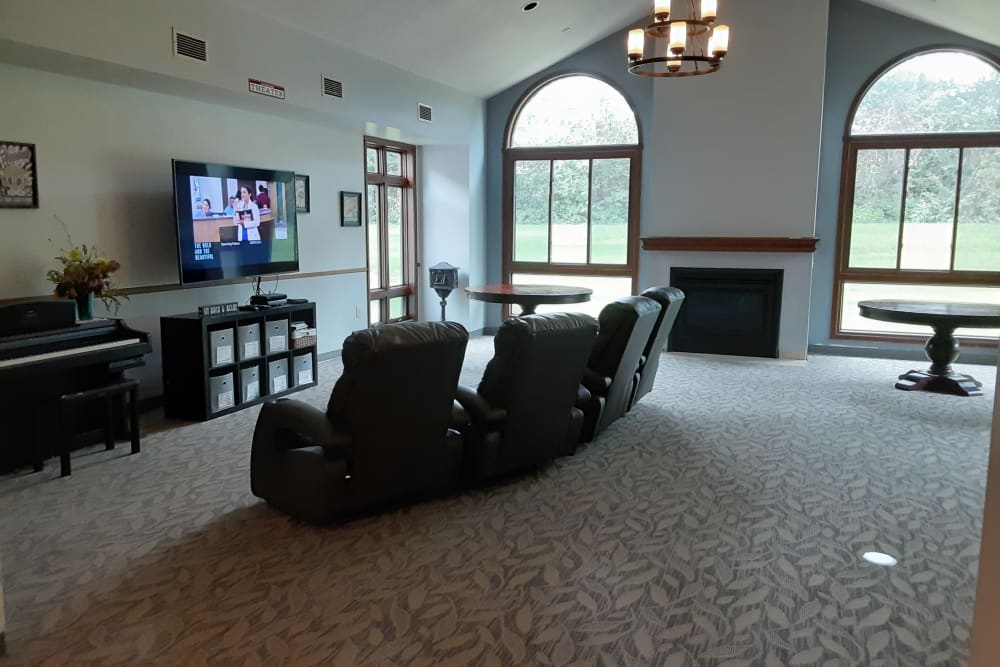 Community TV room and fireplace at The Atrium in Rockford, Illinois.