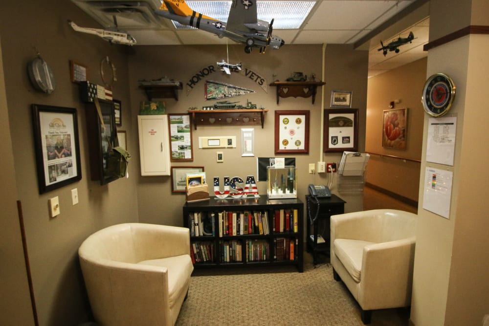 Resident library and chairs at Liberty Court in Dixon, Illinois.