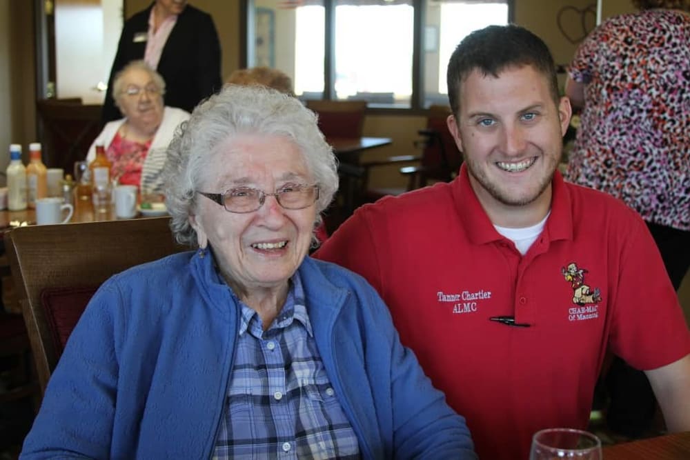 Resident and staff member enjoying dining at Manning Senior Living in Manning, Iowa.