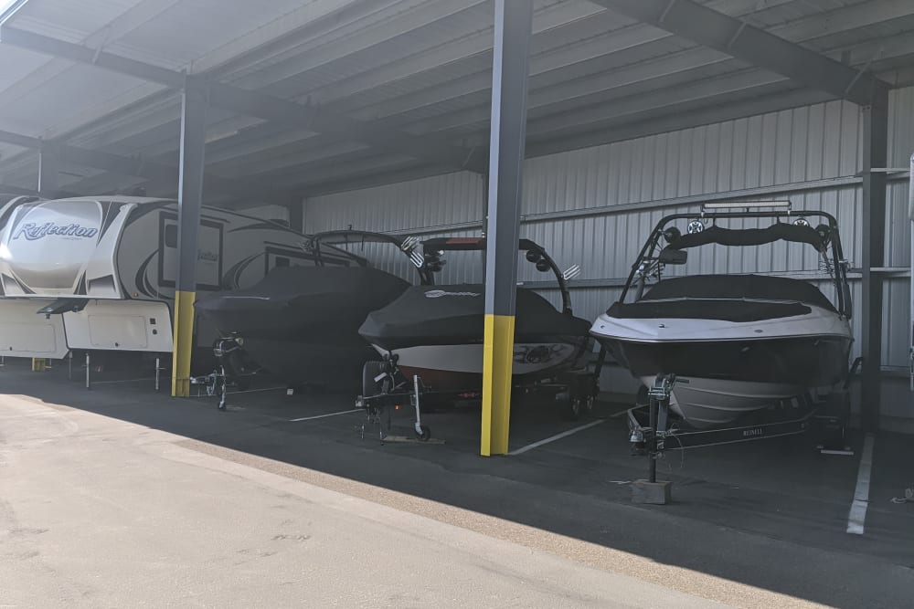 Boats parked in covered storage at Canby RV & Boat Storage in Canby, Oregon