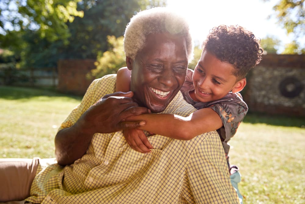 Resident and grandchild play outdoors at Marla Vista in Green Bay, Wisconsin.