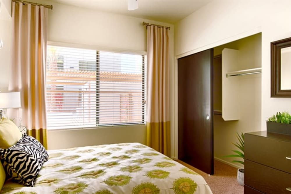 Well-furnished model home's bedroom at Cactus Forty-2 in Phoenix, Arizona