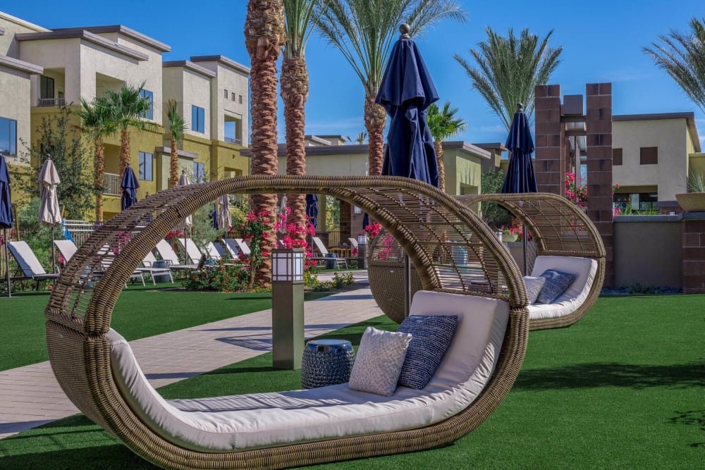 Wicker lounge chairs near the pool at Cadia Crossing in Gilbert, Arizona