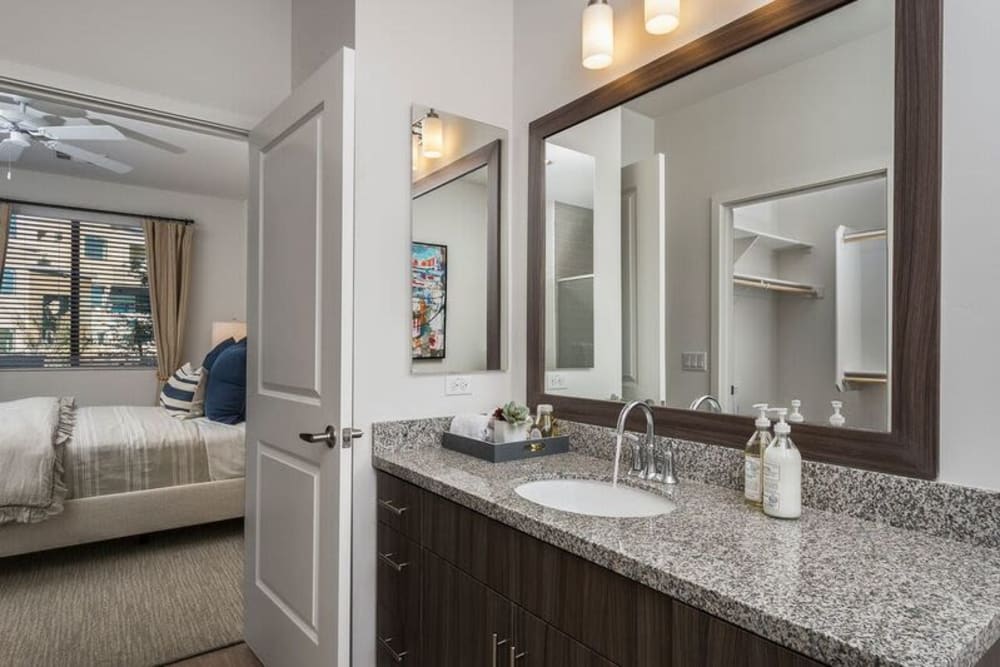 View of the master bedroom from the en suite bathroom in a model home at Cadia Crossing in Gilbert, Arizona