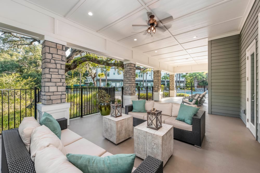 Covered outdoor lounge with a ceiling fan at Canopy at Citrus Park in Tampa, Florida