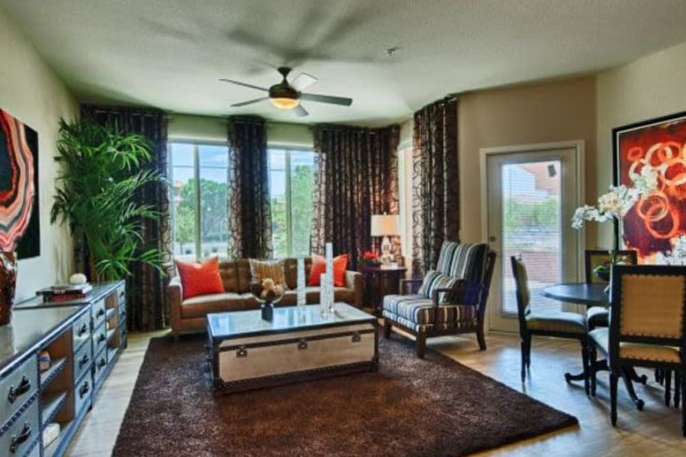 Ceiling fan and hardwood flooring in a model apartment's living area at Elevation Chandler in Chandler, Arizona