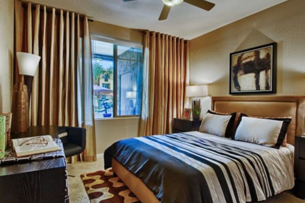 Well-decorated master bedroom in a model home at Elevation Chandler in Chandler, Arizona