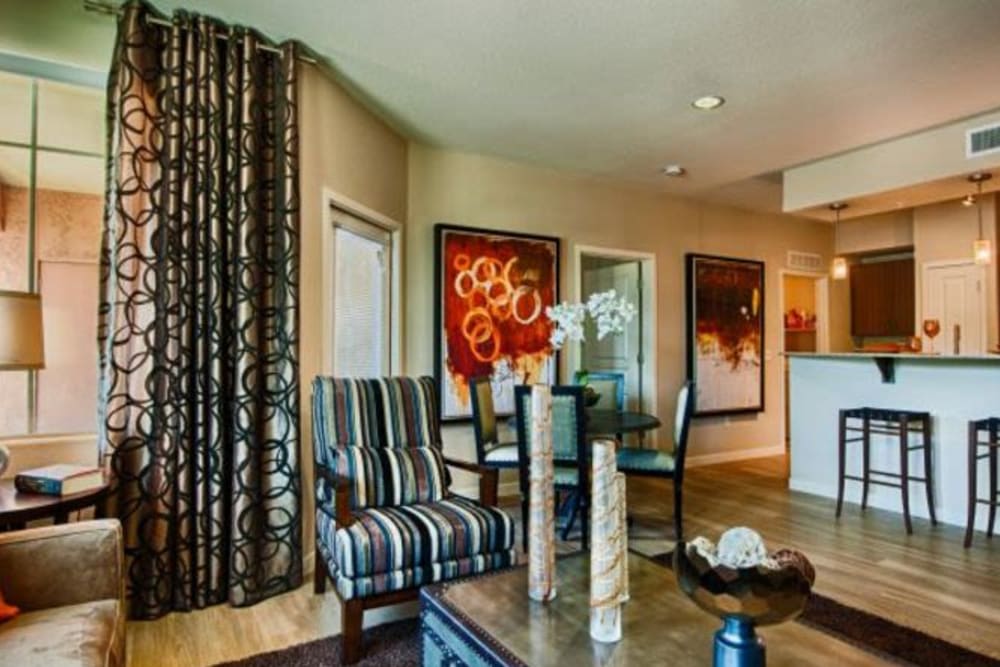 Draped windows and fine furnishings in a model home's living space at Elevation Chandler in Chandler, Arizona