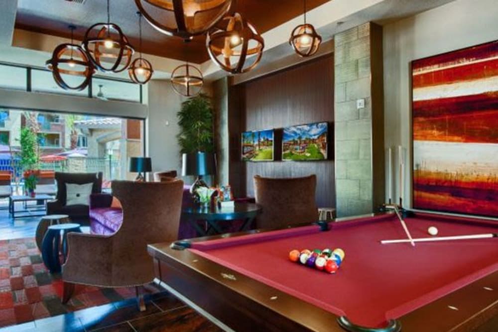Game room with billiards and more in the clubhouse at Elevation Chandler in Chandler, Arizona