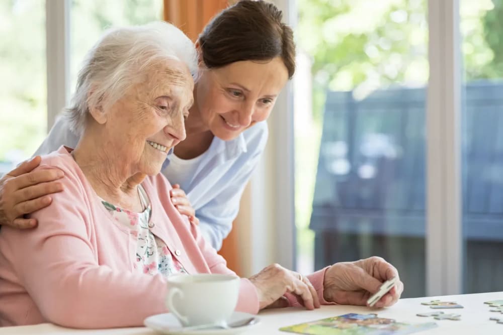 Residents doing a puzzle at The Preserve of Roseville in Roseville, Minnesota.