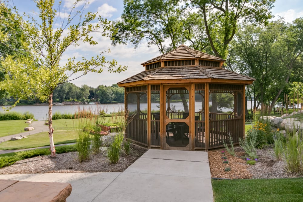 Gazebo with manicured lawns at Applewood Pointe of Champlin in Champlin, Minnesota. 