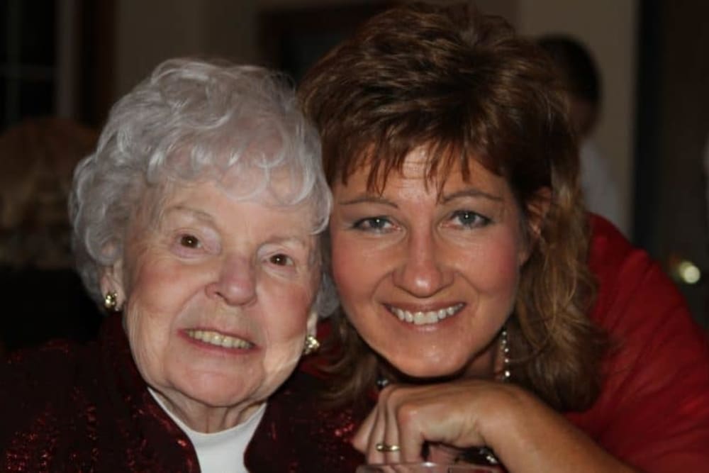 Family member joins resident for holiday celebration at Lawton Senior Living in Lawton, Iowa.