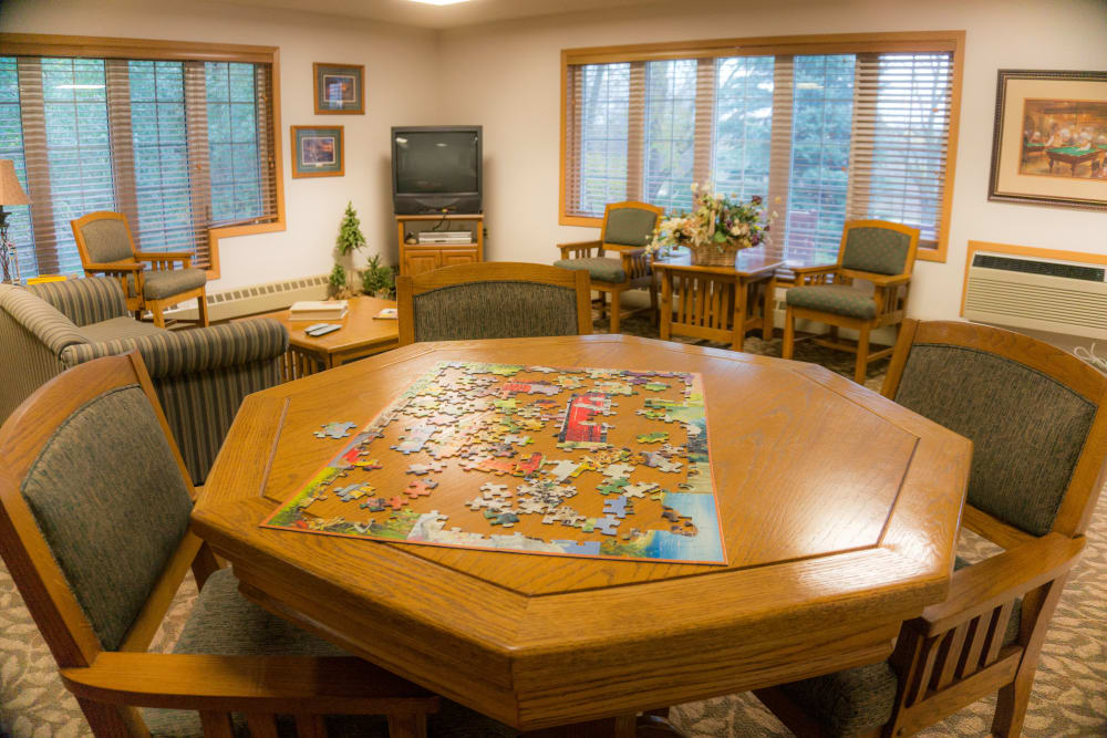 Community room with puzzles at Meadow Lakes Senior Living in Rochester, Minnesota.