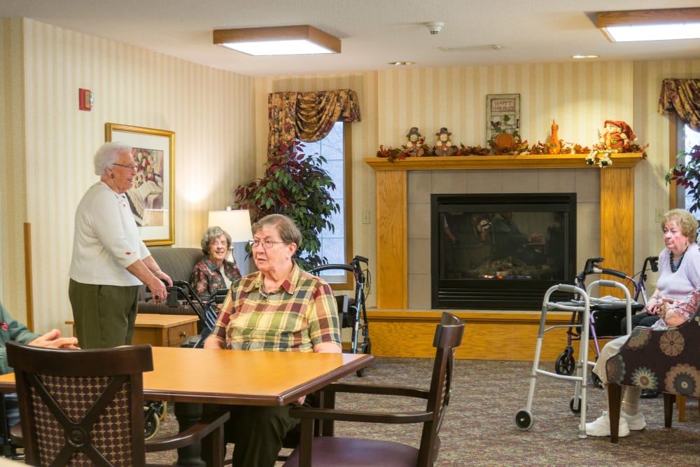 Residents visiting together in lounge at Meadow Lakes Senior Living in Rochester, Minnesota.