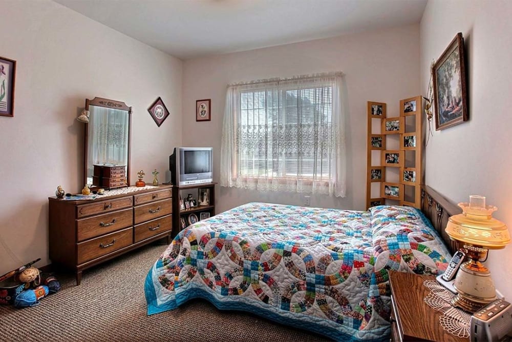 Spacious private resident bedroom at Milestone Senior Living Hillsboro in Hillsboro, Wisconsin. 