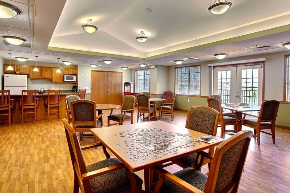 Activity room with games and a kitchenette at Milestone Senior Living Hillsboro in Hillsboro, Wisconsin.