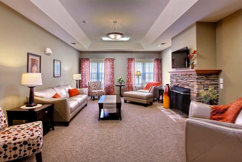 TV lounge with fireplace at Milestone Senior Living Hillsboro in Hillsboro, Wisconsin.
