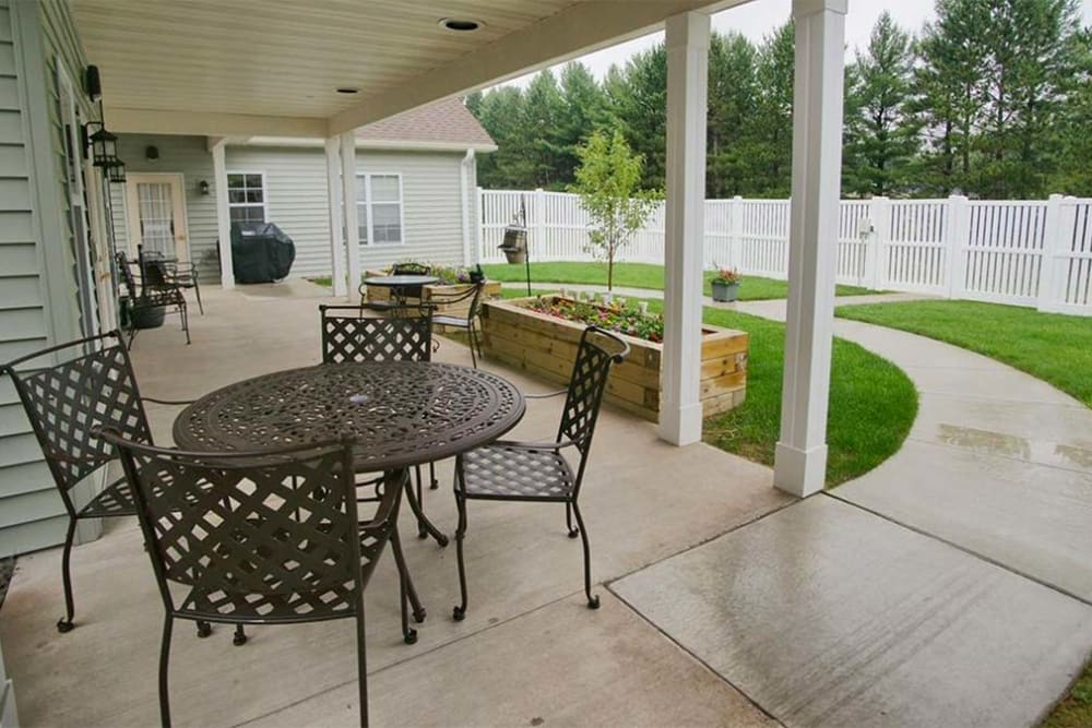 Outdoor seating and grilling area at Milestone Senior Living Rhinelander in Rhinelander, Wisconsin.