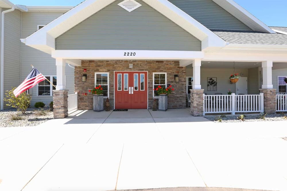 Main entrance and covered porch at Milestone Senior Living Stoughton in Stoughton, Wisconsin.