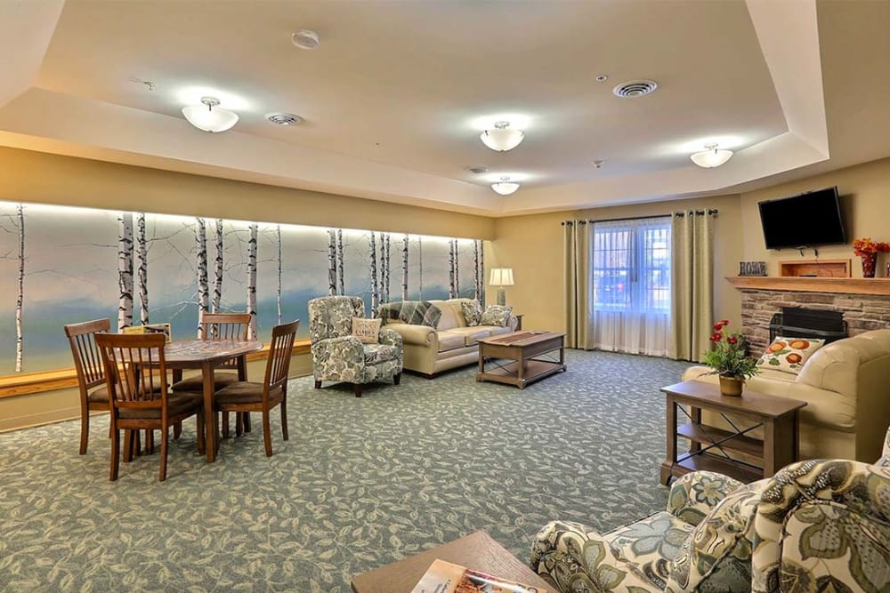 Brightly lit resident lounge at Milestone Senior Living Tomahawk in Tomahawk, Wisconsin. 