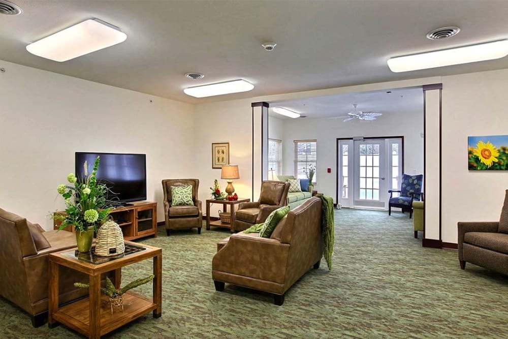 Community lounge with TV at Milestone Senior Living Woodruff in Woodruff, Wisconsin.