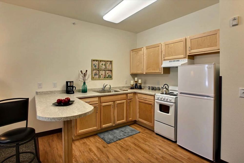 Full kitchens in resident apartments at Milestone Senior Living Woodruff in Woodruff, Wisconsin. 