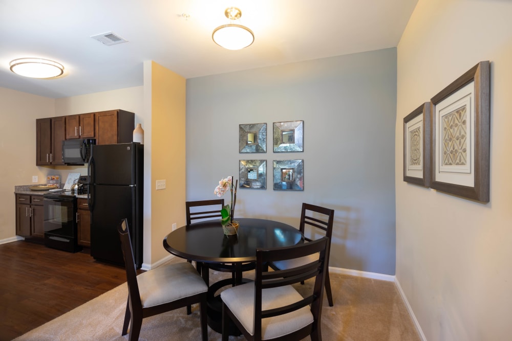 Dining area with an accent wall in a model home at Legends at White Oak in Ooltewah, Tennessee