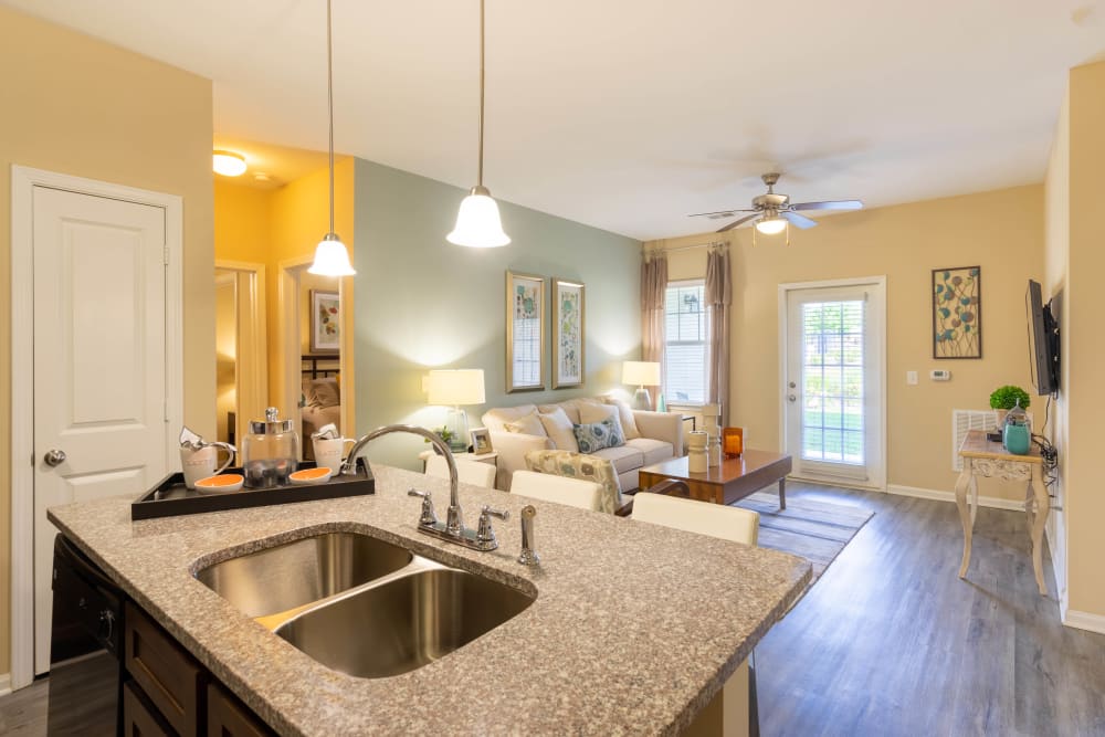 View of the living area from the open-concept kitchen of a model home at Legends at White Oak in Ooltewah, Tennessee