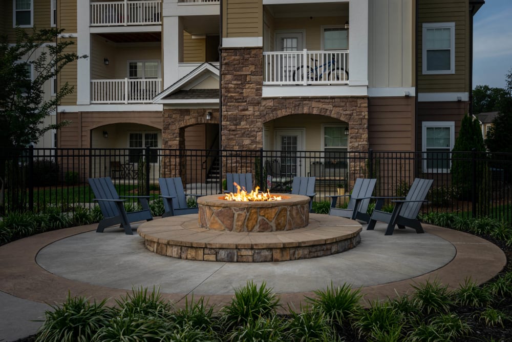 Fire pit lit up in the early evening at Legends at White Oak in Ooltewah, Tennessee