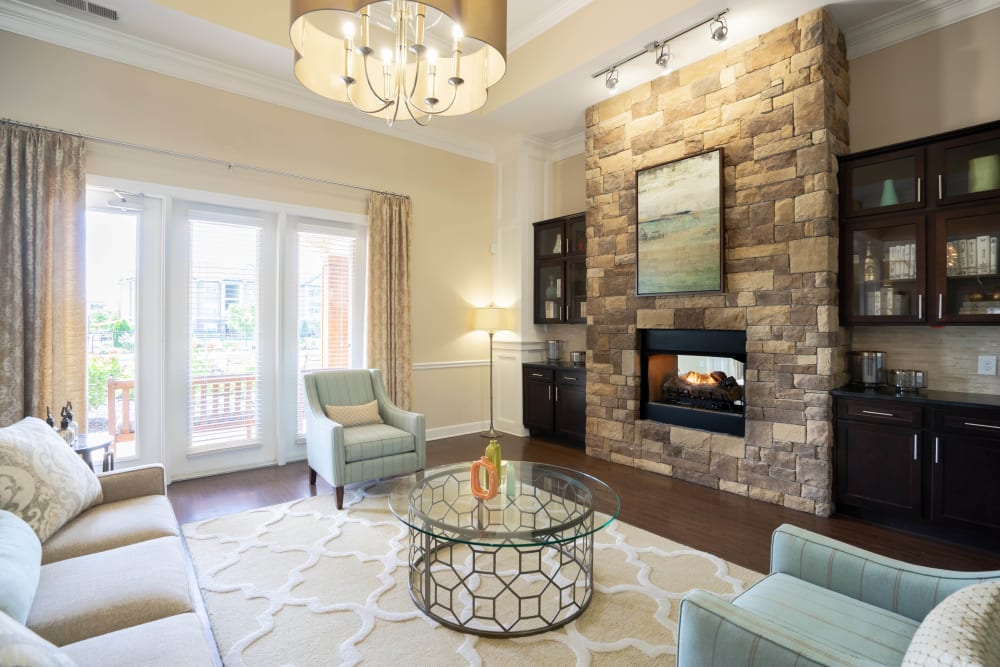 Lounge area in front of the fireplace in the clubhouse at Legends at White Oak in Ooltewah, Tennessee