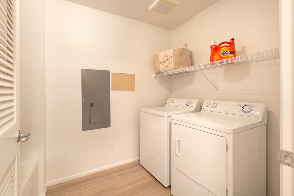 Model home's in-unit washer and dryer at Olympus at Daybreak in South Jordan, Utah