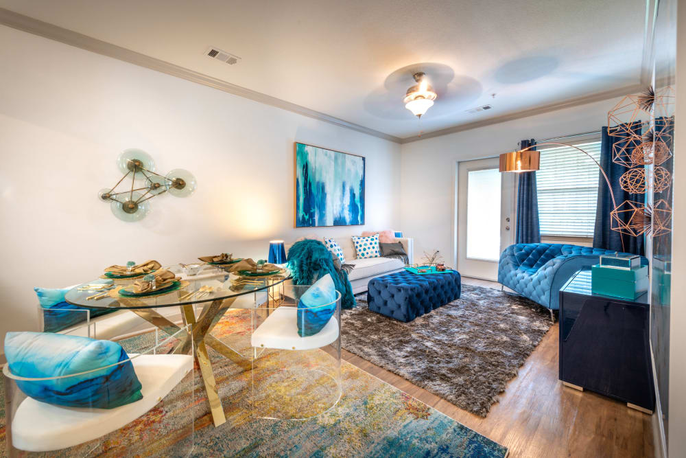 Ceiling fan and hardwood flooring in a model apartment home's living area at Olympus Carrington in Pooler, Georgia