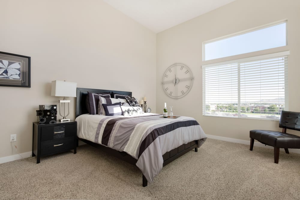 Well-lit bedroom of Olympus at the District in South Jordan, Utah