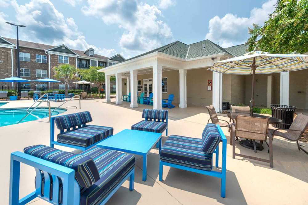 One of the lounge areas by the pool at Olympus Carrington in Pooler, Georgia