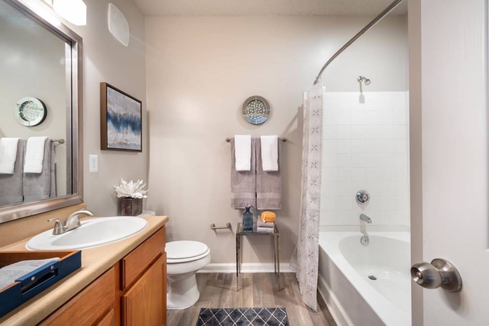 Tiled shower with an oval soaking tub in a model home's bathroom at Olympus Fenwick in Savannah, Georgia