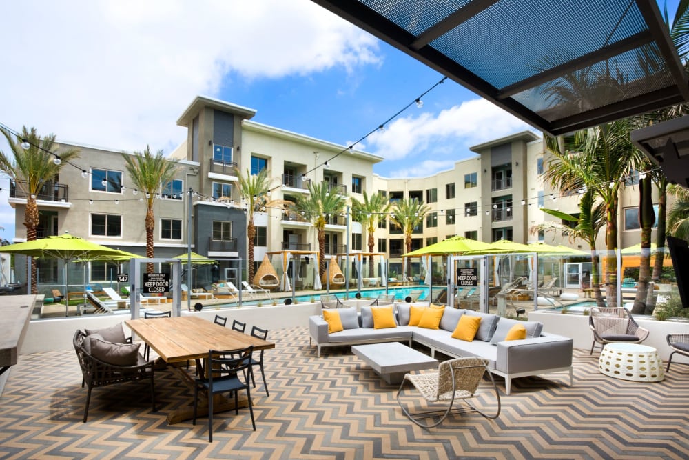 Outdoor pool lounge at Olympus Corsair in San Diego, California