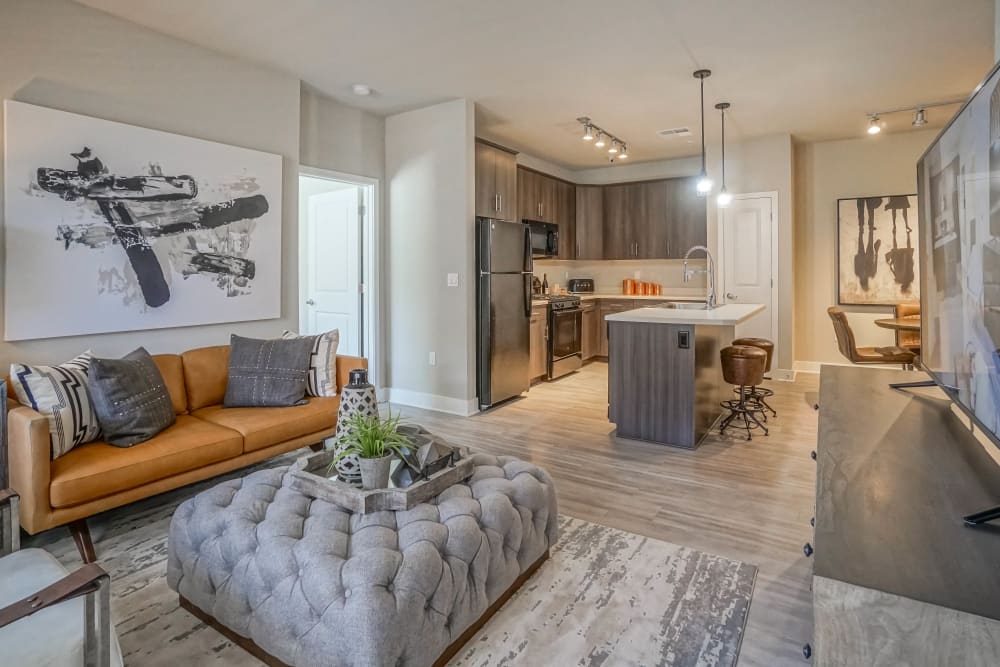 Classic decor and hardwood floors in the living space of a model townhome at Olympus Northpoint in Albuquerque, New Mexico