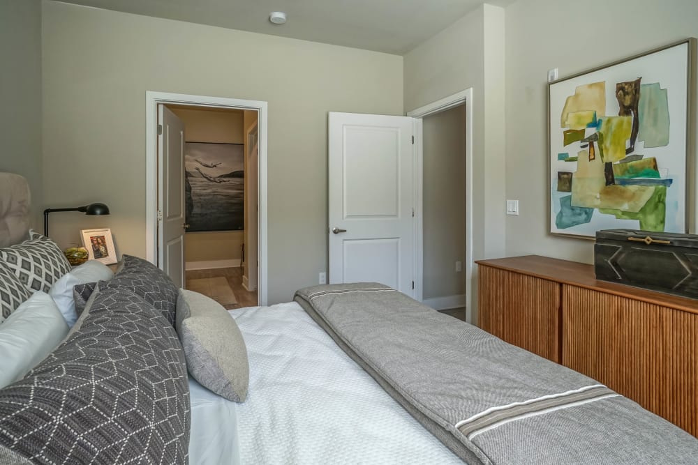Model home's primary bedroom with an en suite bathroom at Olympus Northpoint in Albuquerque, New Mexico